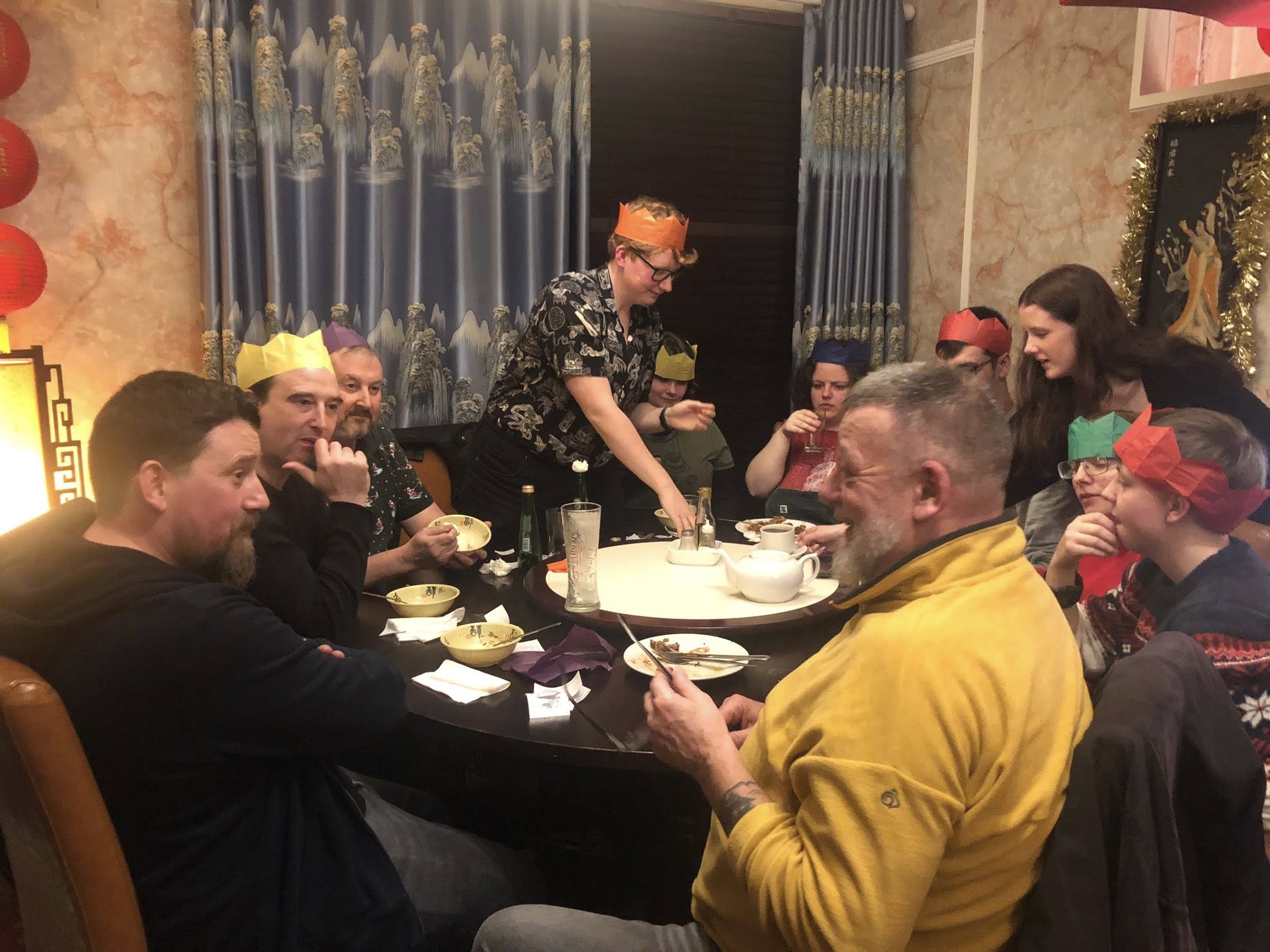 Club Christmas dinner with crackers and crowns