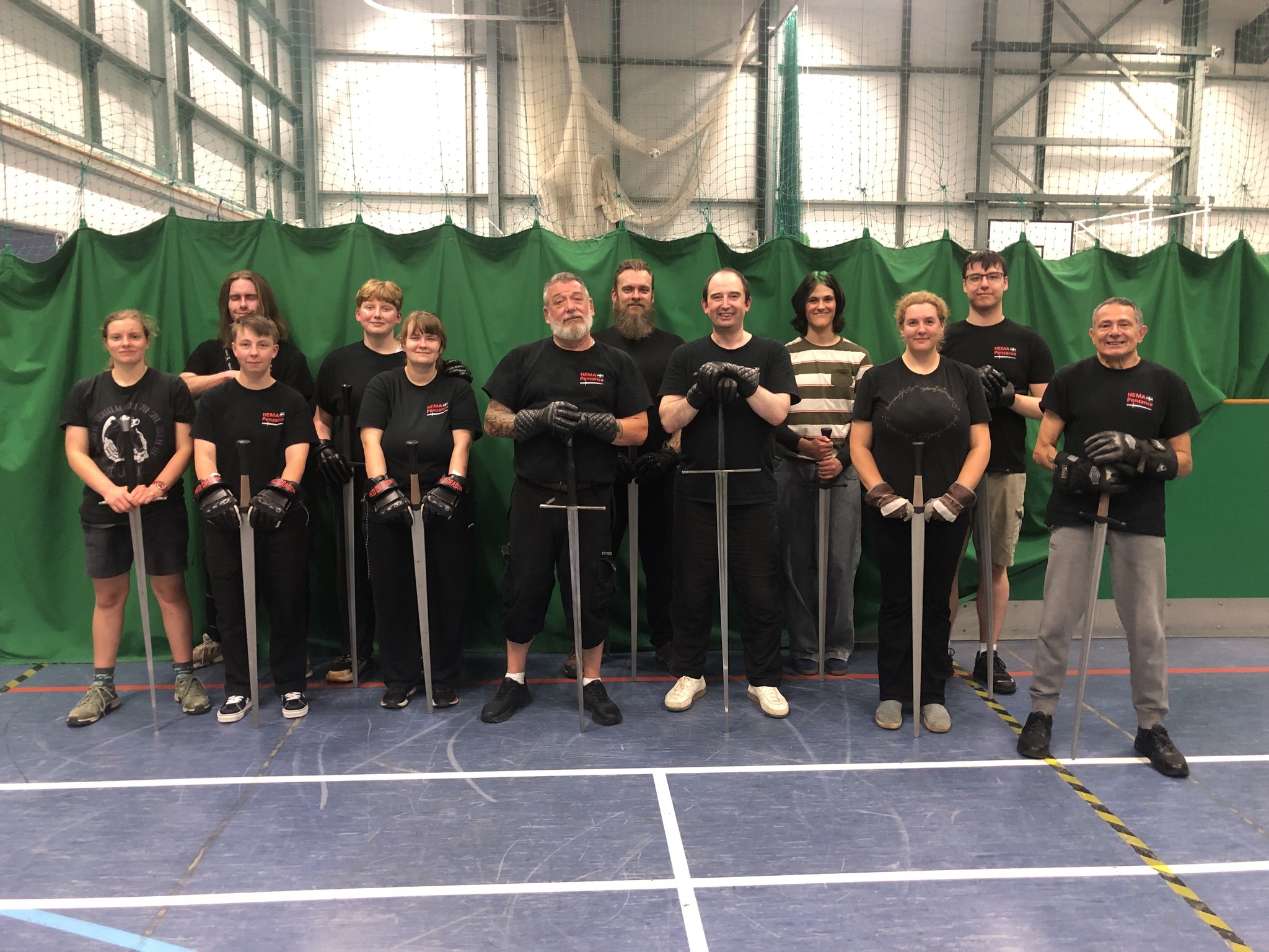 HEMA Penzance members lined up with longswords