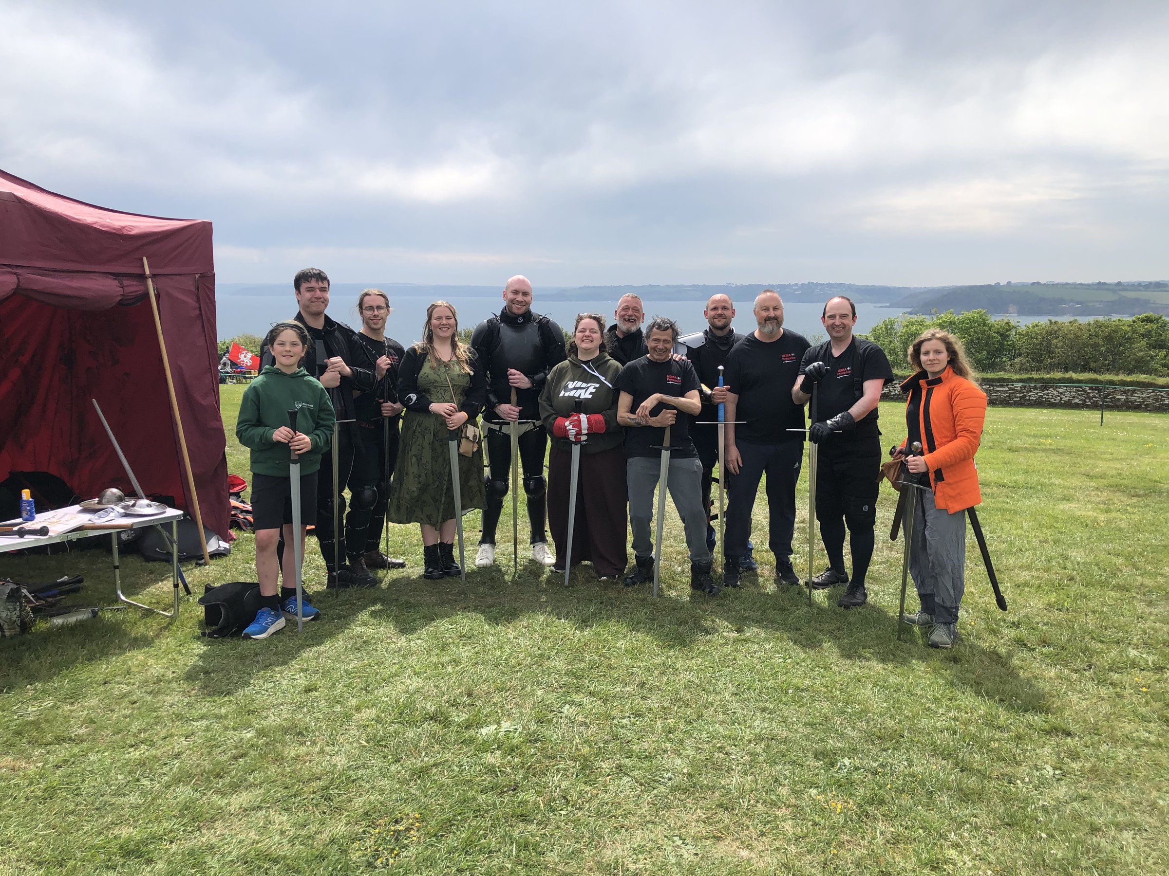 HEMA Penzance members lined up with longswords at FABLEFUSION 2026