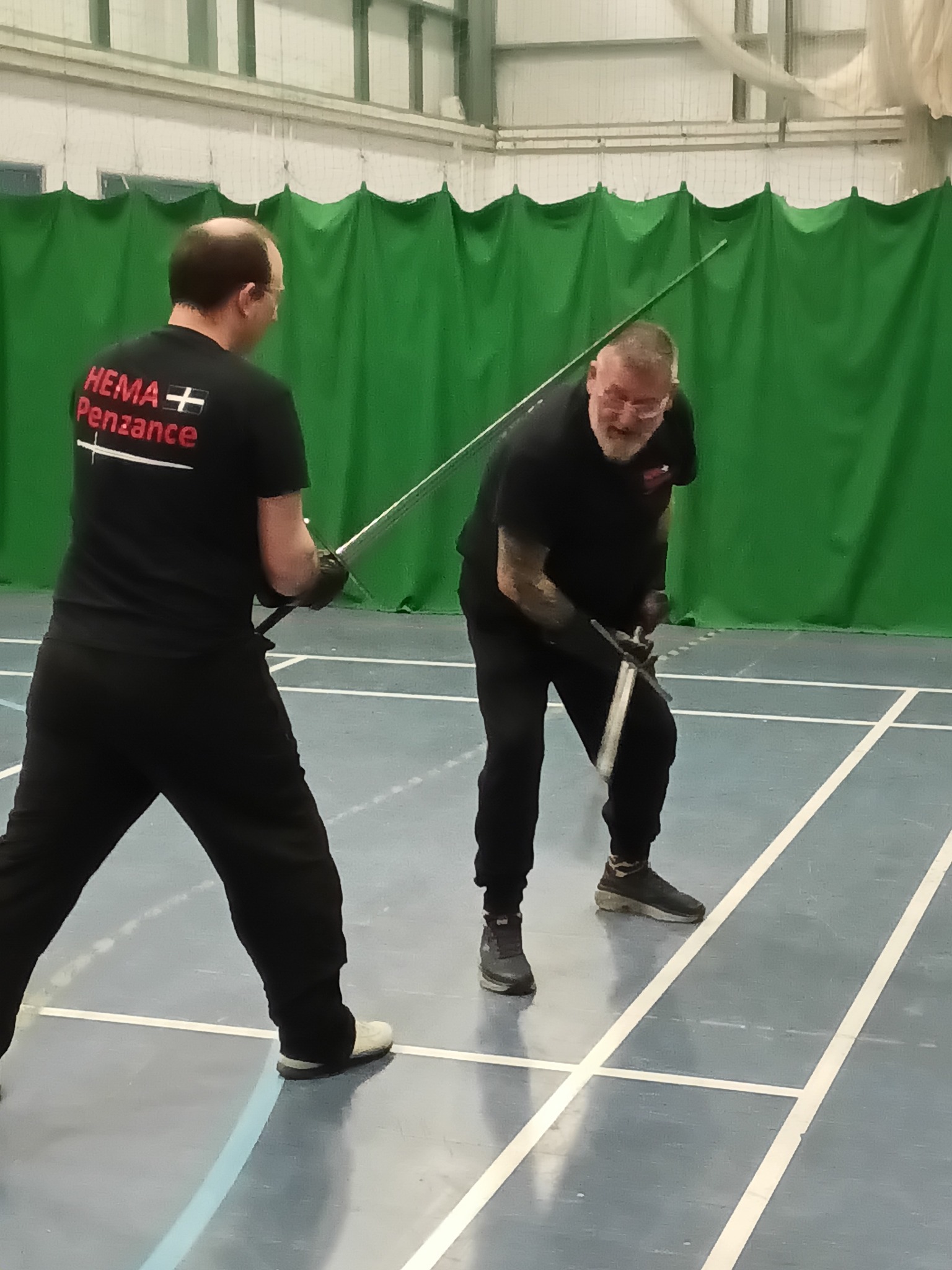 Andrew and Steve sparring with longswords