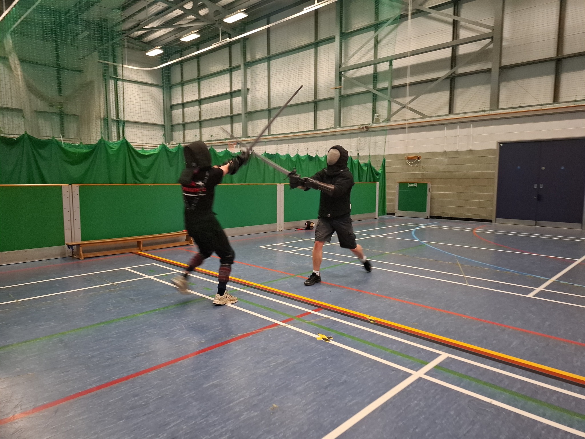 Masked longsword sparring at full distance