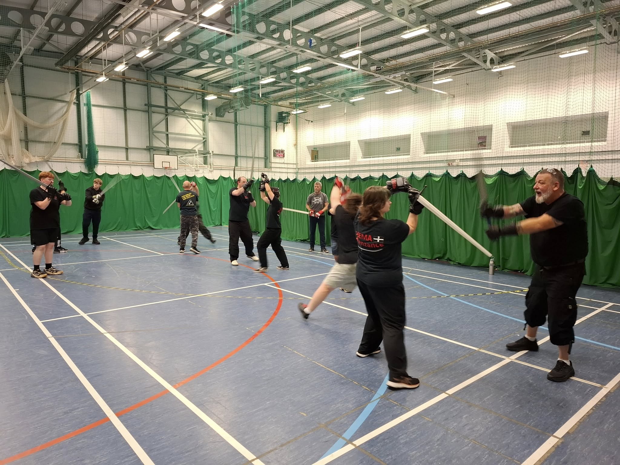 Multiple pairs sparring during a busy session